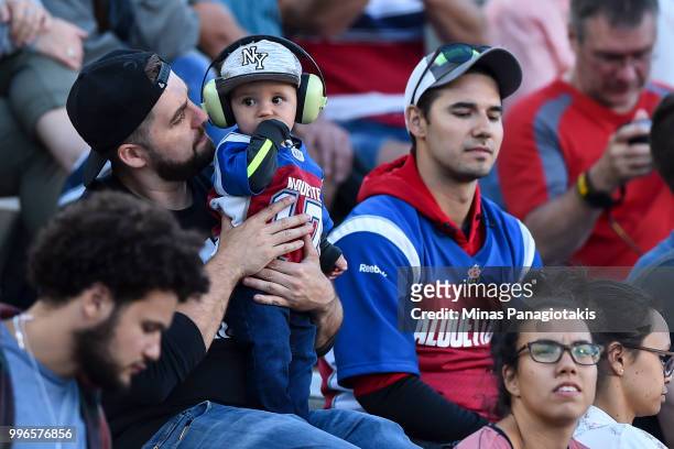 Young fan takes in the atmosphere during the CFL game between the Montreal Alouettes and the Ottawa Redblacks at Percival Molson Stadium on July 6,...