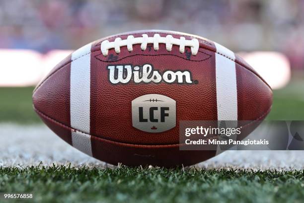 Football sits on the field during the CFL game between the Montreal Alouettes and the Ottawa Redblacks at Percival Molson Stadium on July 6, 2018 in...