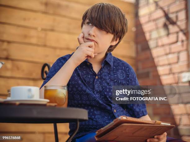 patio time with moter and son - fotografia stock pictures, royalty-free photos & images