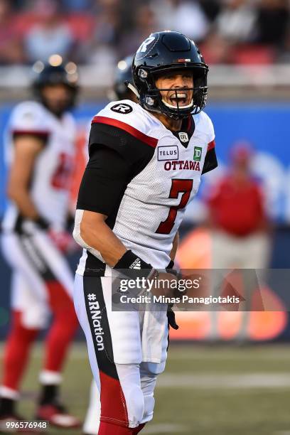 Quarterback Trevor Harris of the Ottawa Redblacks yells out instructions against the Montreal Alouettes during the CFL game at Percival Molson...