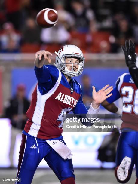 Quarterback Jeff Mathews of the Montreal Alouettes throws the ball against the Ottawa Redblacks during the CFL game at Percival Molson Stadium on...