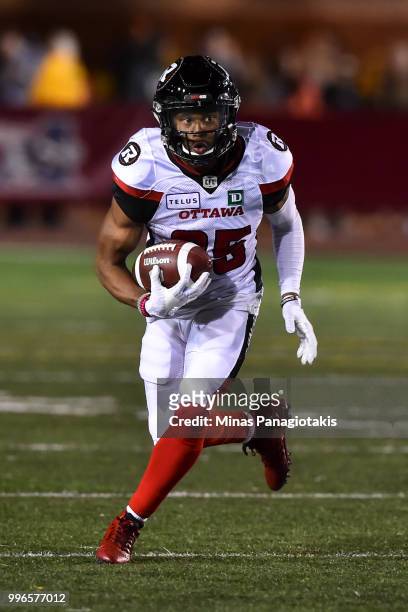 Wide receiver Diontae Spencer of the Ottawa Redblacks runs with the ball against the Montreal Alouettes during the CFL game at Percival Molson...