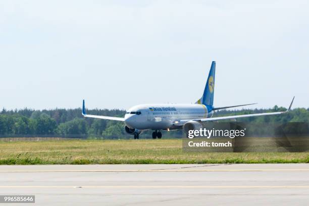 the aircraft of the ukraine international airlines accelerating to take off at the boryspil airport, ukraine - ukraine international airlines stock pictures, royalty-free photos & images
