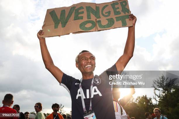 Fan of England show his banner with words 'Wenger Out' before the 2018 FIFA World Cup Russia Semi Final match between England and Croatia at Luzhniki...