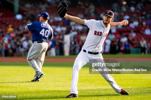 Chris Sale of the Boston Red Sox and Bartolo Colon of the Texas Rangers warm up before a game on July 11, 2018 at Fenway Park in Boston,...