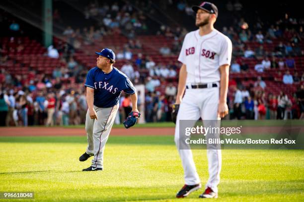 Chris Sale of the Boston Red Sox and Bartolo Colon of the Texas Rangers warm up before a game on July 11, 2018 at Fenway Park in Boston,...