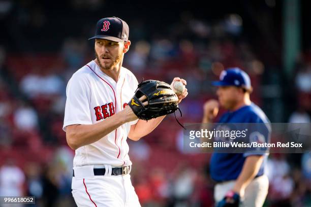 Chris Sale of the Boston Red Sox and Bartolo Colon of the Texas Rangers warm up before a game on July 11, 2018 at Fenway Park in Boston,...