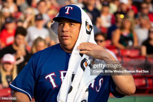 Bartolo Colon of the Texas Rangers wears a towel as he warms up before a game against the Boston Red Sox on July 11, 2018 at Fenway Park in Boston,...