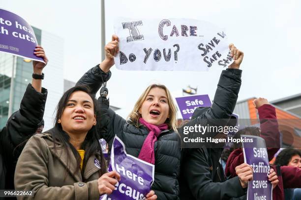 Nurses and Workers Union members hold signs during a strike at Wellington Regional Hospital on July 12, 2018 in Wellington, New Zealand. Thousands of...