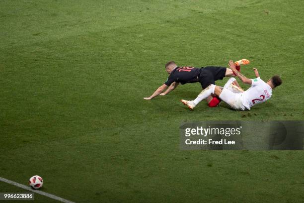 Ante Rebic of Croatia collides with Kyle Walker of England during the 2018 FIFA World Cup Russia Semi Final match between England and Croatia at...