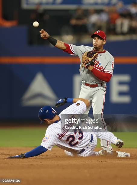 Second baseman Cesar Hernandez of the Philadelphia Phillies gets a force out on Matt den Dekker on a ball off the bat of Amed Rosario during the...