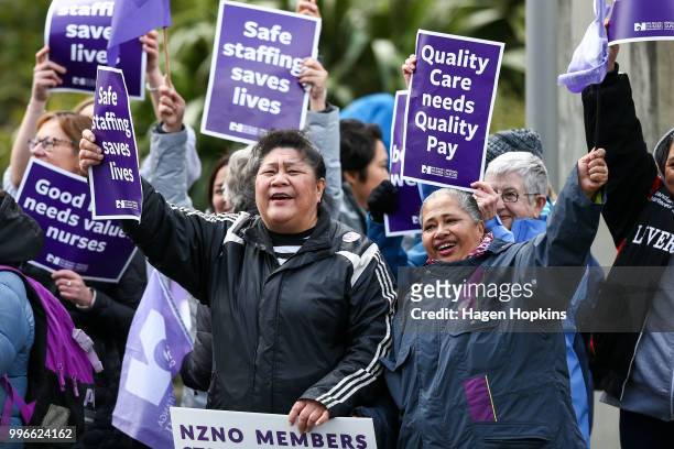Nurses and Workers Union members hold signs during a strike at Wellington Regional Hospital on July 12, 2018 in Wellington, New Zealand. Thousands of...