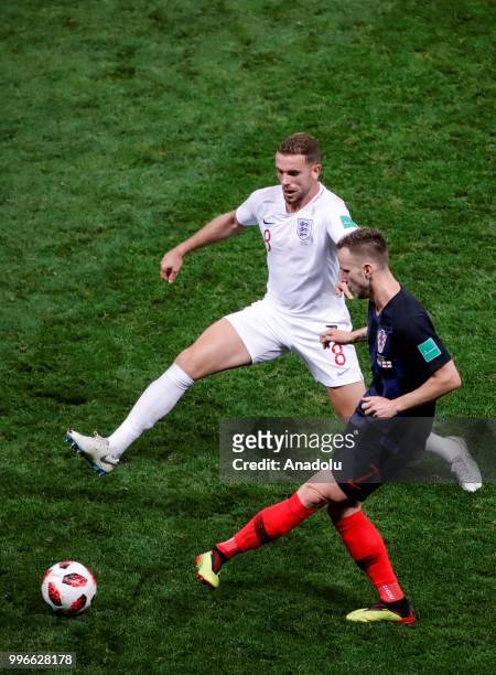 Ivan Rakitic of Croatia in action against Jordan Henderson of England during the 2018 FIFA World Cup Russia Semi Final match between England and...