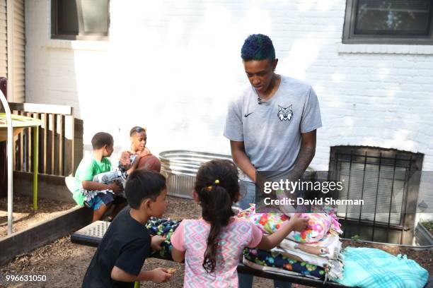 Danielle Robinson of the Minnesota Lynx delivers tie blankets made by Lynx players and staff to family participants of Simpson Housing Services, a...