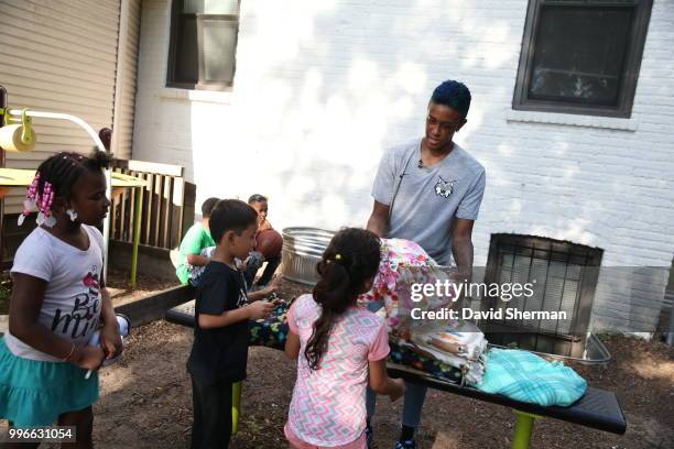 Danielle Robinson of the Minnesota Lynx delivers tie blankets made by Lynx players and staff to family participants of Simpson Housing Services, a...