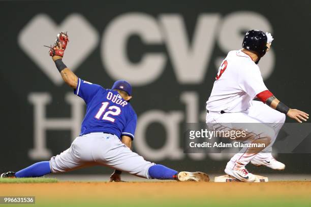 Rougned Odor of the Texas Rangers stretches to make the out at second base in the sixth inning of a game against the Boston Red Sox at Fenway Park on...