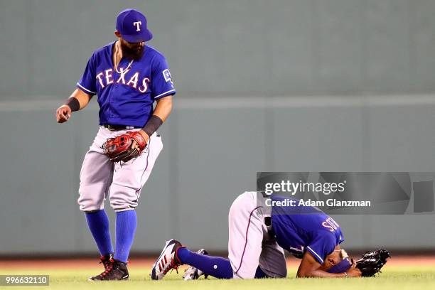 Delino DeShields of the Texas Rangers reacts after injuring himself in the sixth inning of a gam against the Boston Red Sox at Fenway Park on July...