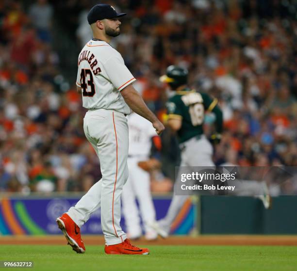 Lance McCullers Jr. #43 of the Houston Astros reacts after giving up a three run home run to Chad Pinder of the Oakland Athletics in the fourth...