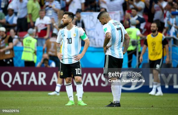 Lionel Messi, Ever Banega of Argentina react following the 2018 FIFA World Cup Russia Round of 16 match between France and Argentina at Kazan Arena...
