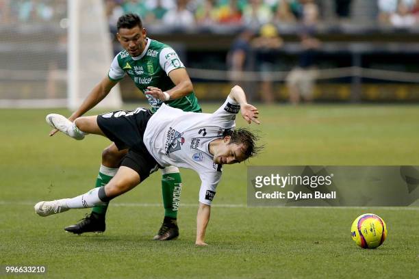 Lvaro Ramos of Club Leon fouls Jose Joaquin Martinez of CF Pachuca in the first half at Miller Park on July 11, 2018 in Milwaukee, Wisconsin.