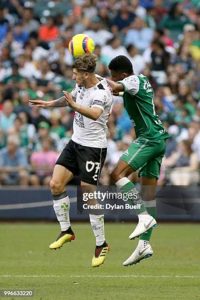 Angel Sagal of CF Pachuca and Cristian Torres of Club Leon attempt a header in the first half at Miller Park on July 11, 2018 in Milwaukee, Wisconsin.