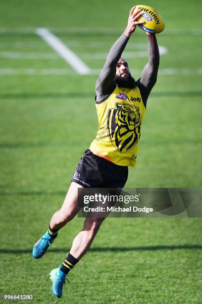 Bachar Houli of the Tigers, tipped by coach Damien Hardwick to return, marks the ball during a Richmond Tigers AFL training session at Punt Road Oval...