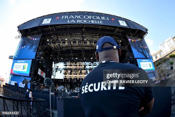 Security agent in charge of the security during the 34th edition of the Francofolies Music Festival in La Rochelle, southwestern France, on July 11,...