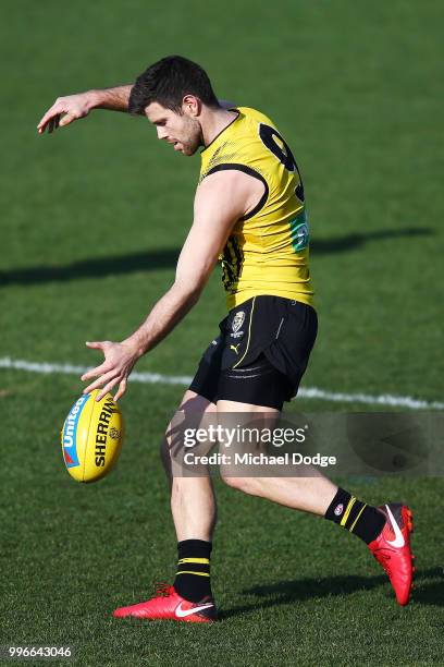 Trent Cotchin of the Tigers kicks the ball during a Richmond Tigers AFL training session at Punt Road Oval on July 12, 2018 in Melbourne, Australia.