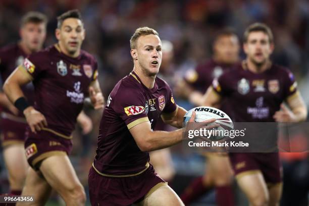 Daly Cherry-Evans of Queensland runs the ball during the round 10 Super Netball match between the Giants and the Swifts at the International...