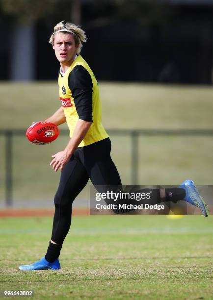 Darcy Moore of the Magpies looks upfield during a Collingwood Magpies AFL training session at the Holden Centre on July 12, 2018 in Melbourne,...