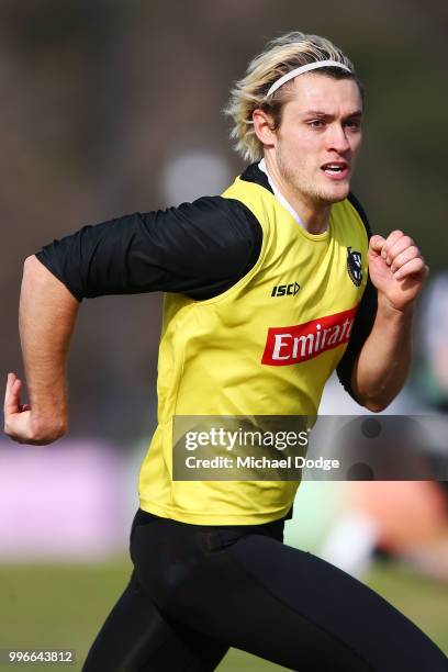 Darcy Moore of the Magpies runs upfield during a Collingwood Magpies AFL training session at the Holden Centre on July 12, 2018 in Melbourne,...