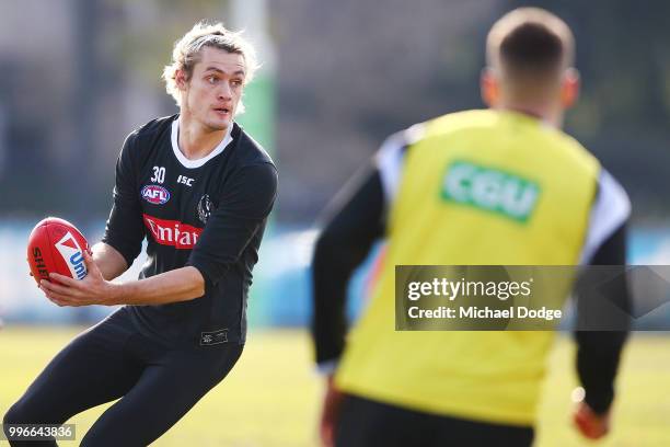 Darcy Moore of the Magpies looks upfield during a Collingwood Magpies AFL training session at the Holden Centre on July 12, 2018 in Melbourne,...