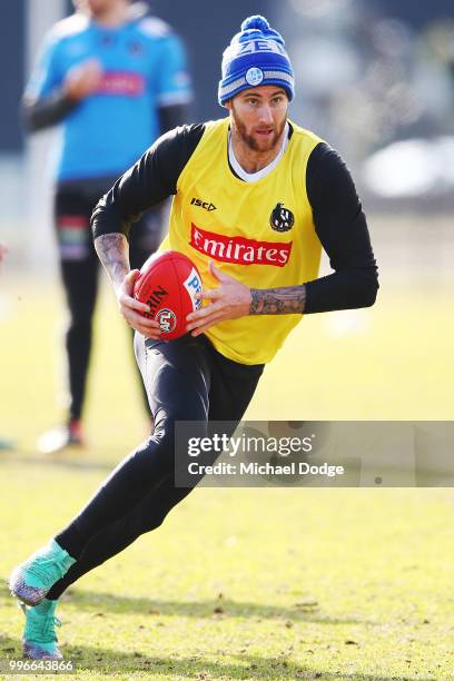 Jeremy Howe of the Magpies runs with the ball during a Collingwood Magpies AFL training session at the Holden Centre on July 12, 2018 in Melbourne,...