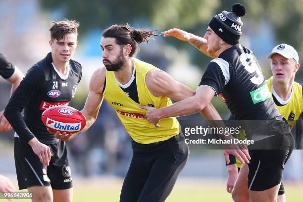 Brodie Grundy of the Magpies is tackled by Sam Murray of the Magpies during a Collingwood Magpies AFL training session at the Holden Centre on July...