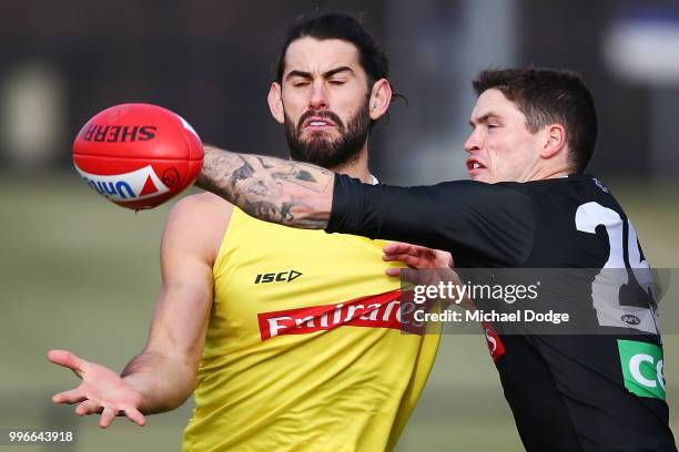 Brodie Grundy of the Magpies competes for the ball against Jack Crisp of the Magpies during a Collingwood Magpies AFL training session at the Holden...