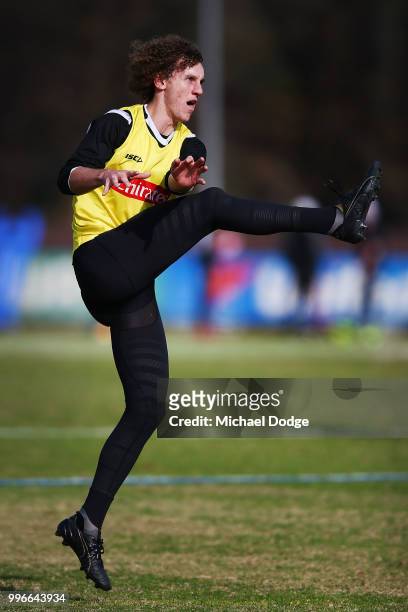 Chris Mayne of the Magpies kicks the ball during a Collingwood Magpies AFL press conference at the Holden Centre on July 12, 2018 in Melbourne,...