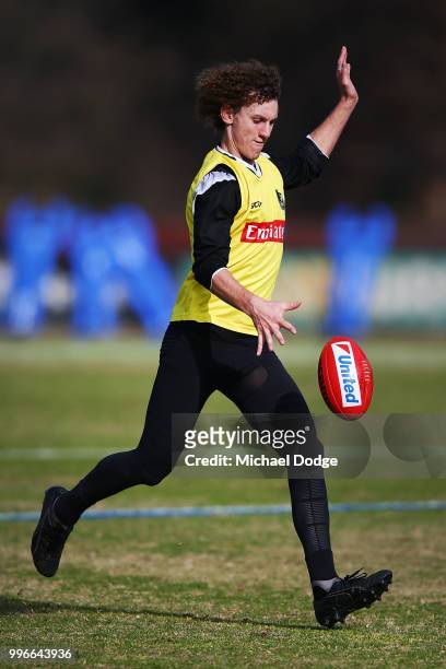 Chris Mayne of the Magpies kicks the ball during a Collingwood Magpies AFL press conference at the Holden Centre on July 12, 2018 in Melbourne,...
