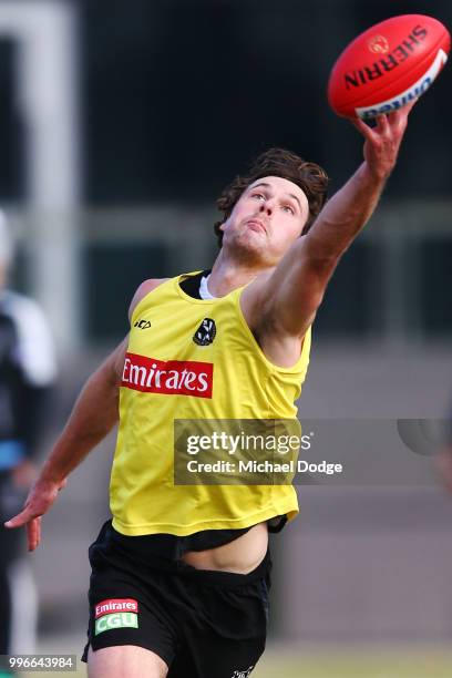 Matthew Scharenberg of the Magpies competes for the ball during a Collingwood Magpies AFL press conference at the Holden Centre on July 12, 2018 in...