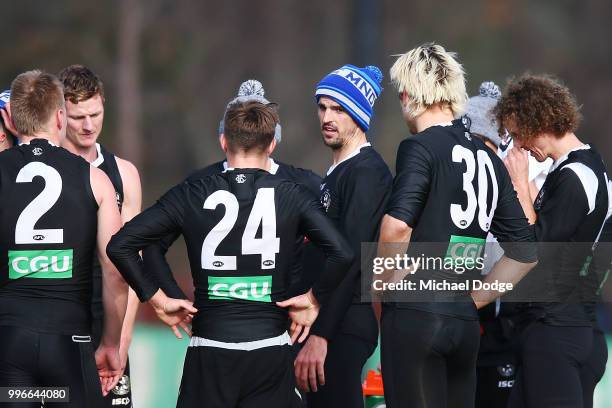 Scott Pendlebury of the Magpies speaks to teammates during a Collingwood Magpies AFL press conference at the Holden Centre on July 12, 2018 in...