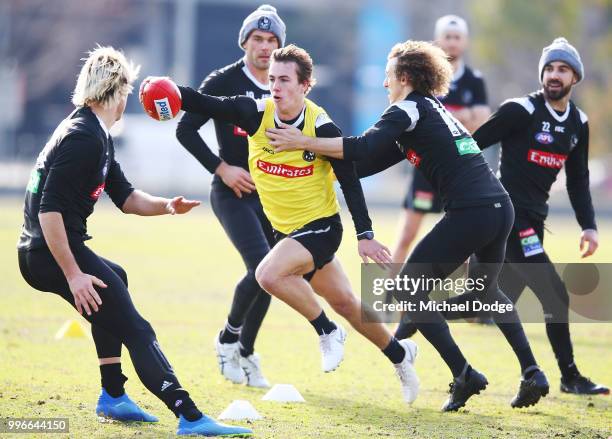 Callum Brown of the Magpies runs with the ball during a Collingwood Magpies AFL press conference at the Holden Centre on July 12, 2018 in Melbourne,...