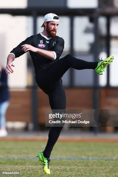 Tyson Goldsack of the Magpies, coming back from a knee reconstruction, kicks the ball during a Collingwood Magpies AFL press conference at the Holden...
