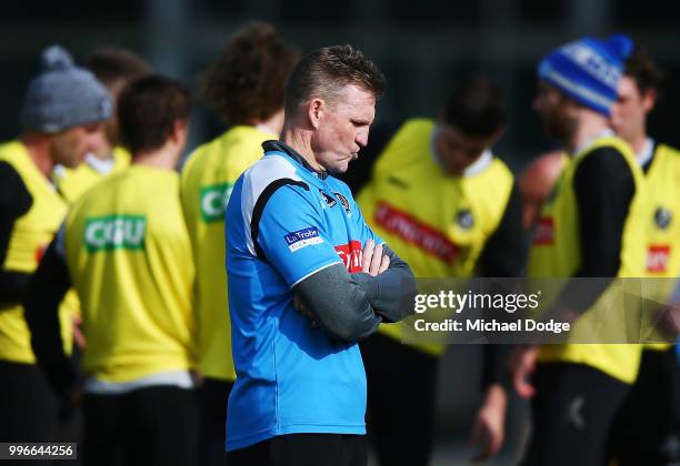 Nathan Buckley looks thoughtful during a Collingwood Magpies AFL training session at the Holden Centre on July 12, 2018 in Melbourne, Australia.