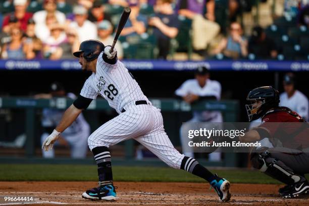 Nolan Arenado of the Colorado Rockies hits an RBI single during the first inning against the Arizona Diamondbacks at Coors Field on July 11, 2018 in...