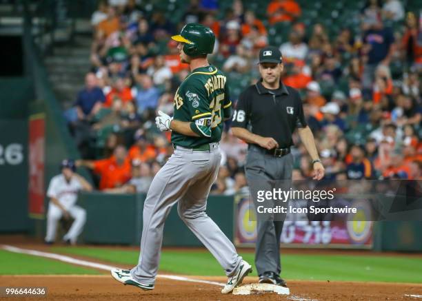 Oakland Athletics right fielder Stephen Piscotty gets a single at the top of the fifth inning during the baseball game between the Oakland Athletics...