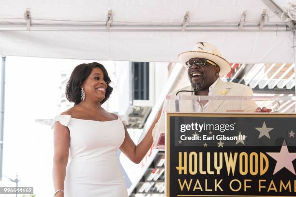 Actress Niecy Nash listens as Cedric The Entertainer speaks onstage as Niecy Nash is honored with a Star On The Hollywood Walk Of Fame on July 11,...