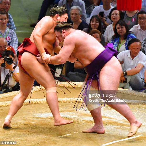 Georgian ozeki Tochinoshin and Abi compete on day four of the Grand Sumo Nagoya Tournament at the Dolphin's Arena on July 11, 2018 in Nagoya, Aichi,...