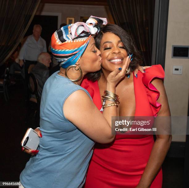 Simone Smith gives actress Niecy Nash a congratulations kiss at the after-party as Niecy Nash is honored with a Star On The Hollywood Walk Of Fame on...