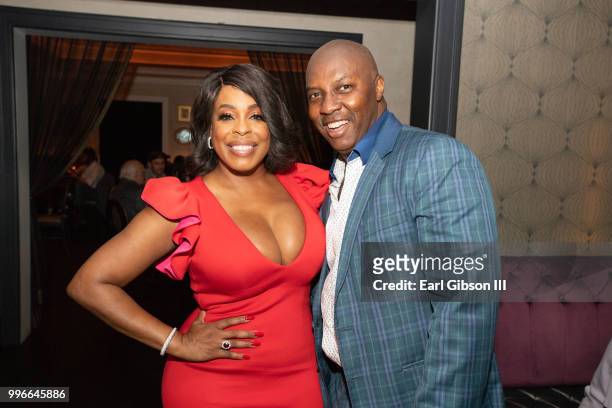 Actress Niecy Nash and celebrity event planner William P. Miller pose for a photo at the after-party to celebrate Niecy Nash's Star On The Hollywood...
