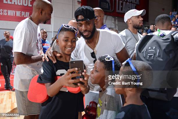 Chris Paul of the Houston Rockets take pictures with fans during the game between the Indiana Pacers and the Cleveland Cavaliers during the 2018 Las...