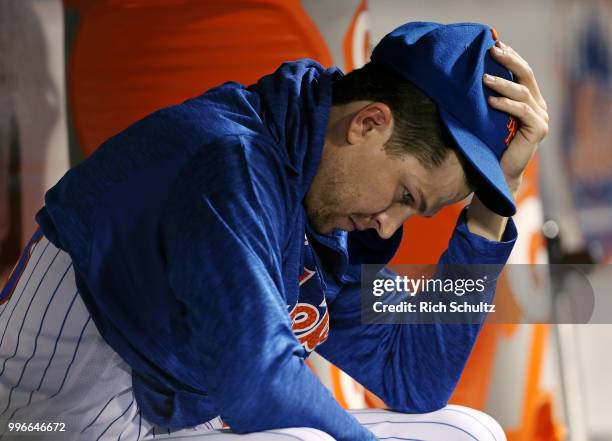 Pitcher Jacob deGrom of the New York Mets sits in the dugout in the ninth inning against the Philadelphia Phillies at Citi Field on July 11, 2018 in...